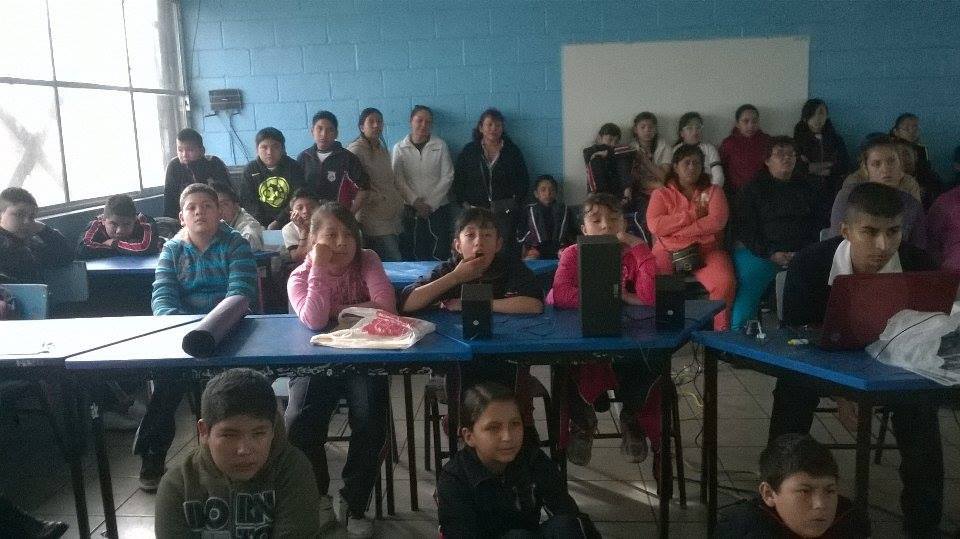 A classroom of children watching José Guadalupe present.